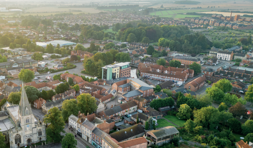 A view of the town of Sleaford with notable buildings like St Denys' Church and the Bass Maltings